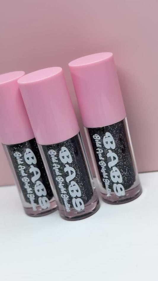 Gothamelon Breeze, Watermelon scented sparkly,black lip gloss ￼